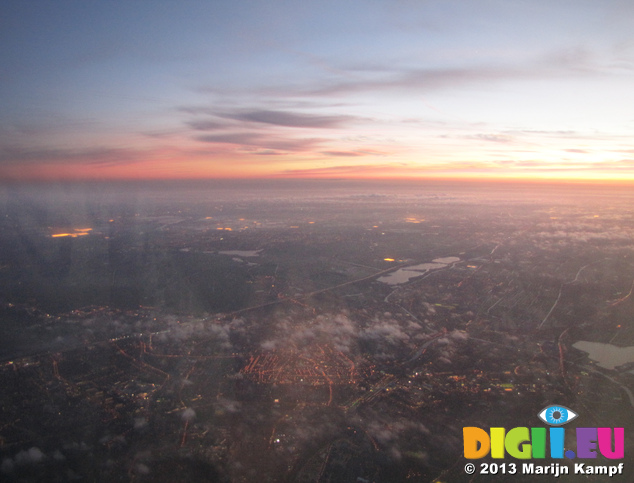 SX32598-9 Sunset from airplane over city lights